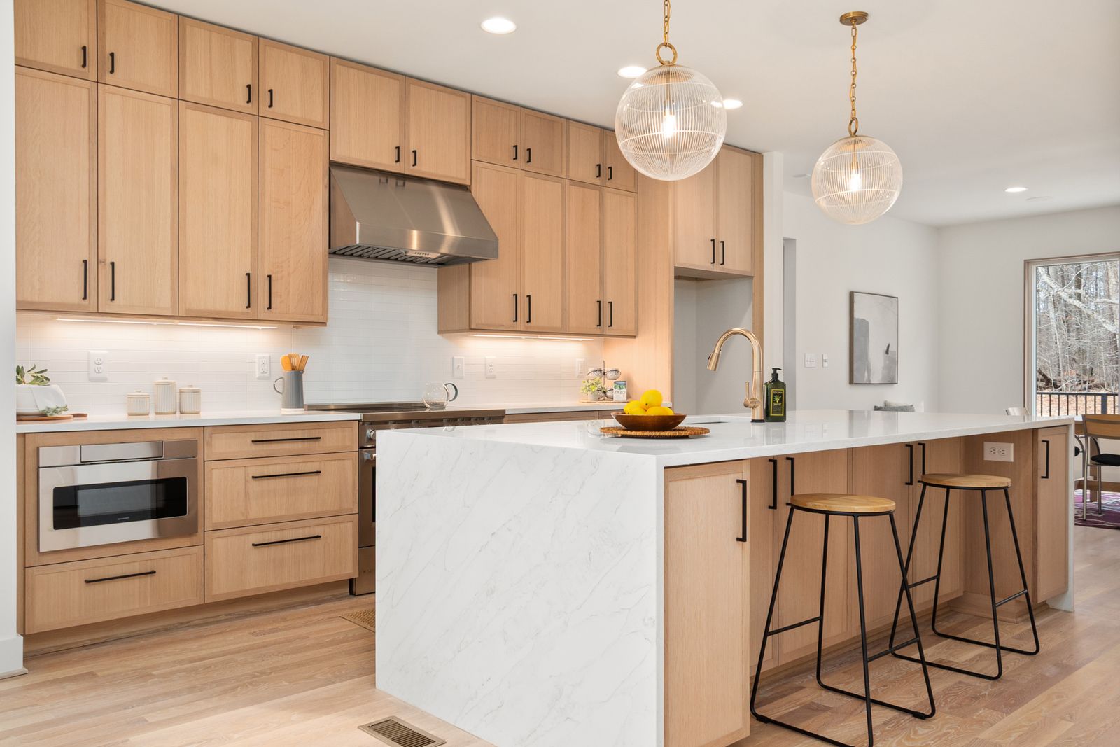 Warm pendant lighting over a kitchen counter