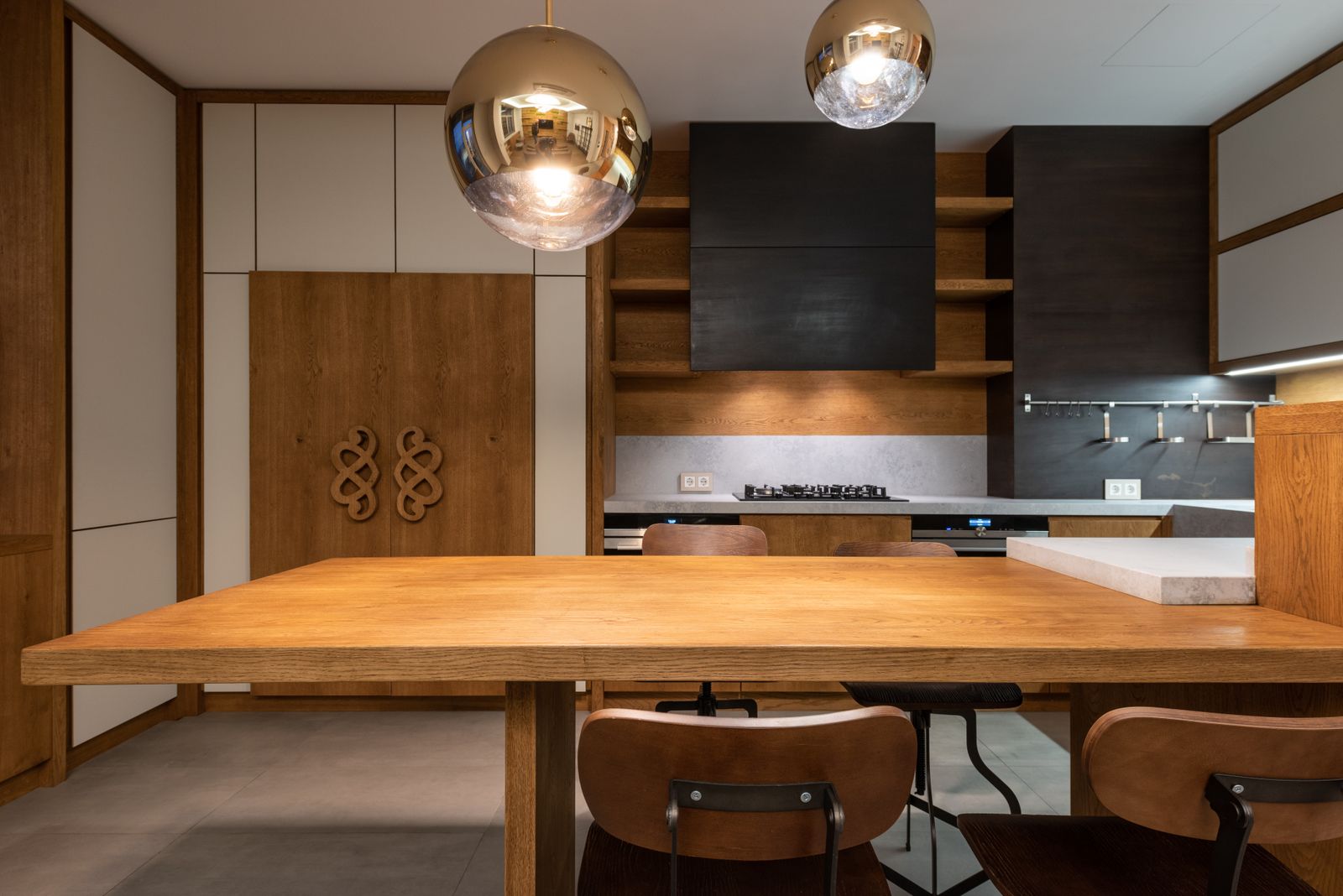 Run of pale timber cabinetry with a consistent reveal between doors