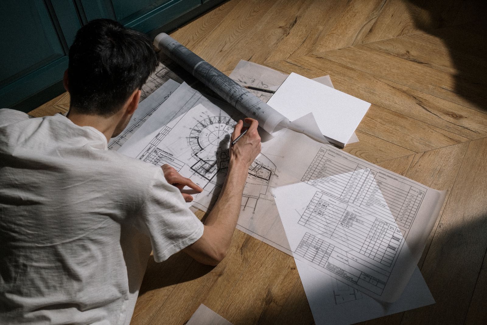 Contract and drawings on a table during a client meeting